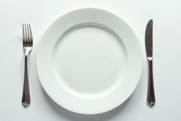 Close-up of empty plate, fork, and glass on white , juice, nutrition