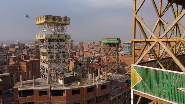 Towers At The Garbage City Of Manshiyat Naser In Cairo, Egypt. - aerial shot