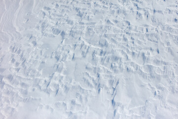 The snow is white and the ground is covered in it