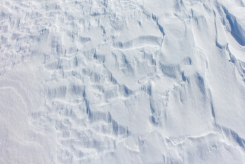 The snow is white and the ground is covered in it