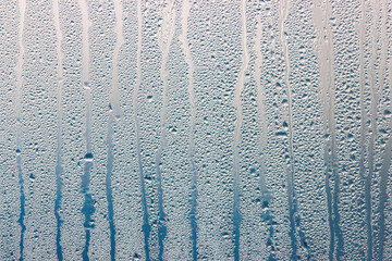A window with a wet, foggy appearance
