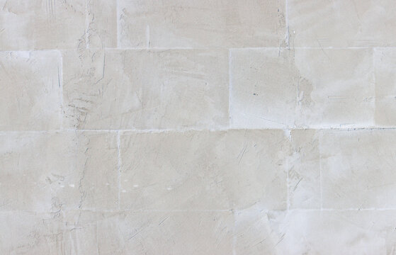 Fototapeta A wall with a white background and a grey brick pattern