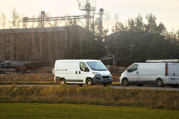 White transport van hauling goods