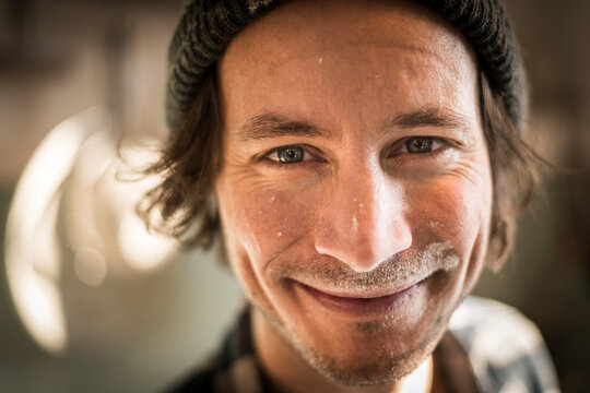 Portrait of a cooking man with flour in his face