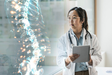 Doctor using augmented reality technology to analyze a spine hologram indoors