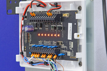 Security and fire alarm equipment with LEDs on. Close-up. Soft focus.