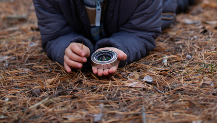 Compass in the hands of a child.