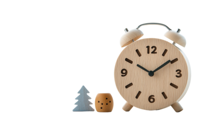 A simple elegant wooden alarm clock with a small decorative plant like figure adds a touch of natural minimalist style to a desk or side table