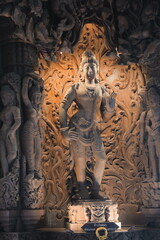 Intricate and Detailed Carvings of a Deity in an Ancient Temple, Reflecting Timeless Beauty