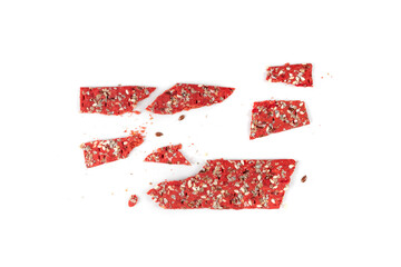 Fototapeta premium Beetroot crackers, thin rusk beet root bread, red diet multigrain crispbread, various seeds