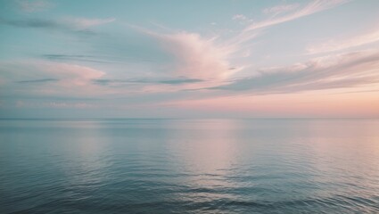 Obraz premium Scenic view of the coastline, featuring the sea, water, and sky. Calm sea and ocean breeze create a peaceful atmosphere. Cloudy and open sky with an endless horizon at sunset near the seashore.