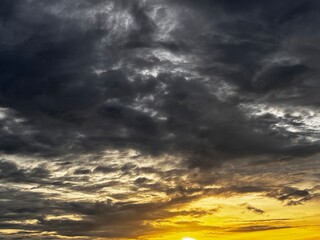 beautiful gradation of orange sky dark black cloudy dramatic, creative natural background