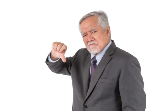 Senior Asian businessman wearing a formal suit and tie, expressing disapproval with a stern facial expression and giving a thumbs-down gesture, isolated on a transparent background