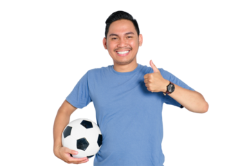 Happy young Asian man giving thumbs up and holding soccer ball, isolated on transparent background