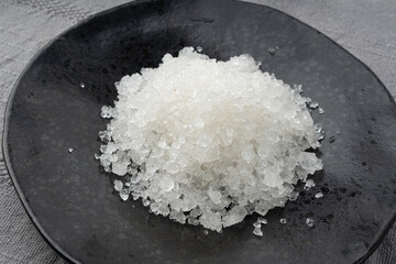Dead sea salt pile, white crystals for body spa, sodium chloride similar to crushed ice, spa scrub