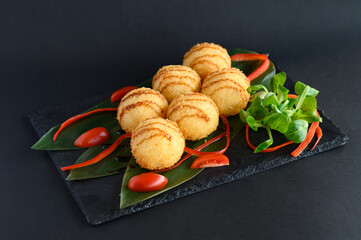 Delicious rice balls filled with fresh, seasoned fish, gently rolled in a light coating and served...