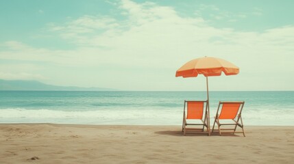 Fototapeta premium peaceful beach scene with orange umbrella and chairs