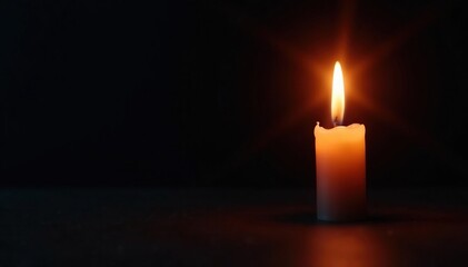 A single candle flame burning brightly in darkness, dark, candle