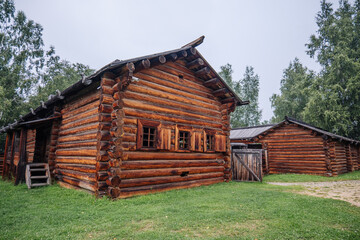 Log cabin showcasing russian rural architecture in a historical setting, preserving cultural heritage amidst nature