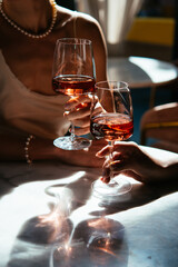 Glasses of rose wine seen during a friendly party or a celebration in a restaurant of a bar.