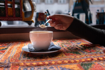 Masala chai an Indian restaurant, spiced milk tea, traditional cardamom hot drink with spices