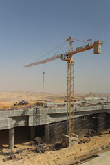 Desert scenery with the highway construction on the road trip from Hurghada to Cairo, Egypt