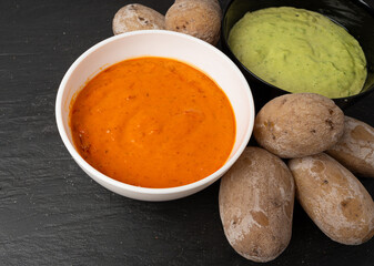 Red mojo rojo and green mojo verde sauces, traditional Tenerife dips, mojo picon dressing