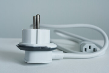 Plug and socket adapter on white background. Close-up.