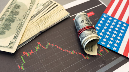 Arrow down and American money. USA flag with decline chart. Decline in USA bond yields. Decrease in...