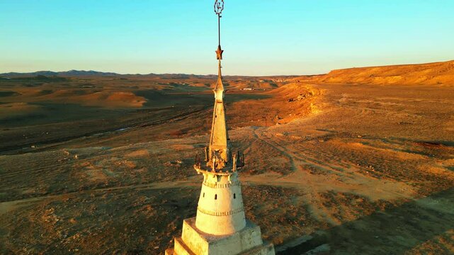 video from drone fly around in a circle close to shpakʹs tower kazakhstan mansgystau in the rays of sunset on a deserted cliff 4k