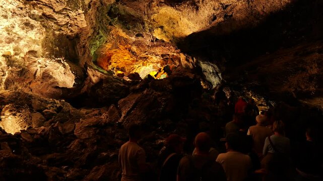 Lanzarote Spain 03 10 2025 Inside Cueva de los Verdes, Lanzarote, where tourists explore an ancient volcanic tunnel. Dramatic rock formations, dim lighting, and echoing sounds create a mysterious a