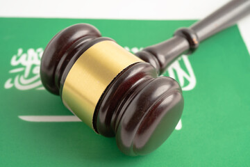Saudi Arabia flag with judge hammer, Law and justice court concept.