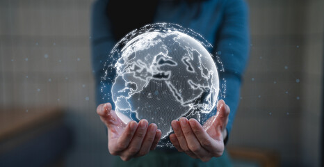 A person holds a glass-like globe, symbolizing global connectivity and technology, with a digital representation of the Earth.