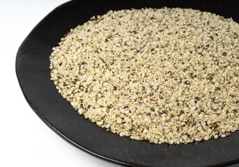 Shelled hemp seeds pile, peeled cannabis grains, marijuana kernels without peel