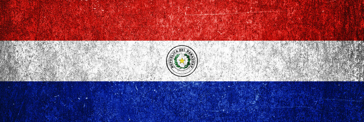 Paraguay state flag on a metal surface. Banner of dirty grunge Paraguay flag.