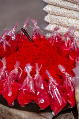Close-up of Colourful Bags of Vibrant Red Powders for Religious Decoration in Pushkar, India