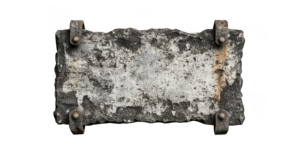 A weathered stone plaque with metal brackets against a stark black background creating contrast