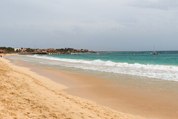 View of the beach in Santa Maria city and the Atlantic Ocean on Sal island. Cape Verde. Africa.