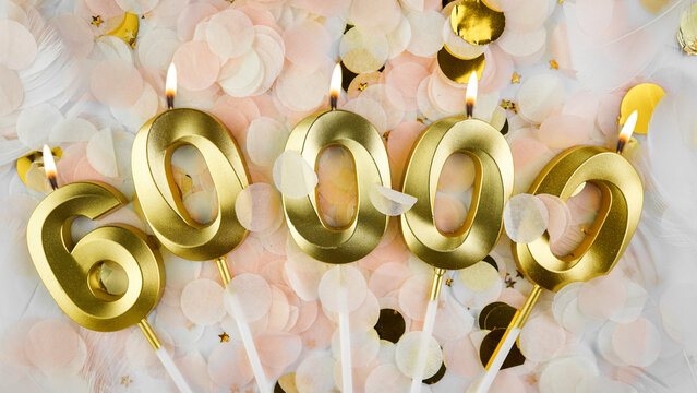60000 followers card. 60k subscribers and online community fans. Social networks and blogs. Confetti background with candles number 60000 for social media celebration.