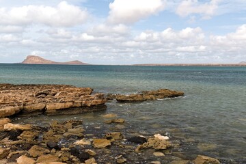 View of Mount Lion (Monte Leao) and the Atlantic Ocean from the coast near Murdeira village. Sal...