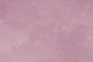 Textured pink plaster wall background with rough stucco effect for modern design projects