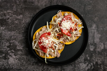 Delicious Pulled Pork Tostadas with Cabbage, Tomato, and Cheese