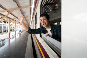 Waving Goodbye from the Train. A traveler waves from the train window, filled with happiness for...