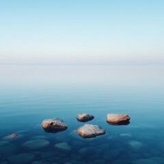 Serene seascape with tranquil rocks and clear blue sky reflections