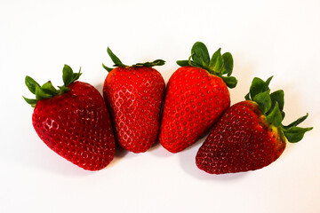 minimalistic photo of ripe and juicy strawberries on a white background