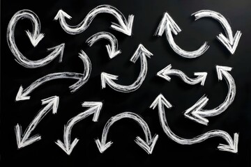 Various hand-drawn white chalk arrows and directional symbols on a black chalkboard background