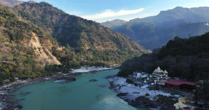Morning Aerial view of the holy city Rishikesh, View of the Ganges river valley in the morning with cloudy sky background, green mountain valley in Uttarakhand