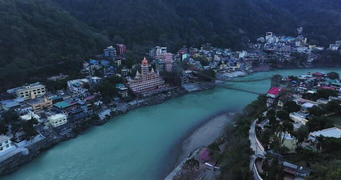 Morning Aerial view of the holy city Rishikesh, View of the Laxman/Lakshman Jhula/Jhoola bridge in the Ganges river valley in the morning, temples of Uttarakhand