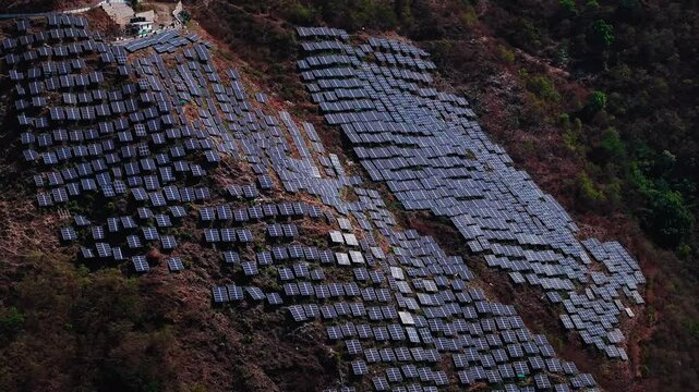 Aerial view of multiple solar panel installations in remote hills of Uttarakhand, Generating Power through solar roof and developing the India concept