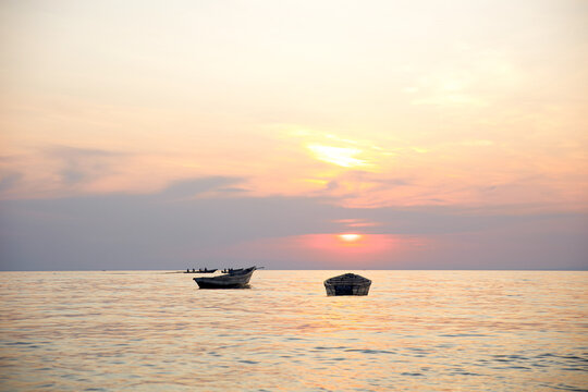 Fishing boats at Lake Tanganyika during sunset in Kigoma, Tanzania on october 24, 2024